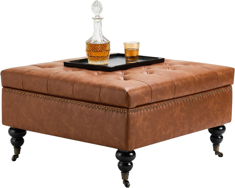 Square leather footstool with storage function, coffee table-style footstool with soft padded raised buttons, equipped with wheels, polyurethane leather high-density sponge, suitable for living room, dormitory, bedroom, in brown color scheme. E6